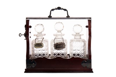 Lot 1375 - A MAHOGANY AND SILVER PLATED THREE BOTTLE TANTALUS