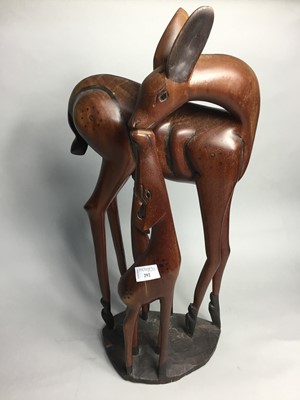 Lot 292 - A CARVED WOOD MODEL OF A DOE AND FAWN