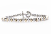 Lot 314 - BI COLOUR DIAMOND SET BRACELET with round...