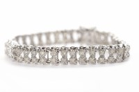Lot 316 - DIAMOND BRACELET with two rows of round...