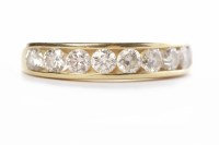 Lot 317 - DIAMOND HALF ETERNITY RING with channel set...