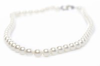 Lot 318 - SINGLE STRAND PEARL CHOKER NECKLACE with a...