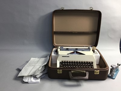 Lot 473 - A VINTAGE TYPEWRITER IN LEATHER CARRY CASE AND A VINTAGE STAPLER