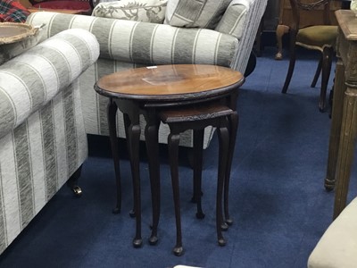 Lot 475 - A MAHOGANY NEST OF TABLES AND AN OVAL WALL MIRROR