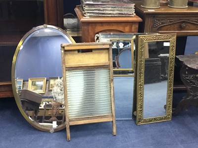 Lot 546 - AN BRASS FRAMED BEVELLED WALL MIRROR, TWO OTHER MIRRORS AND A WASHBOARD