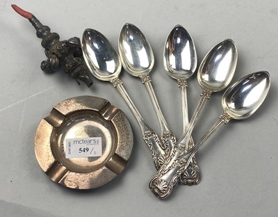 Lot 549 - A SILVER ASHTRAY, FIVE SPOONS AND A VINTAGE CHILD'S RATTLE