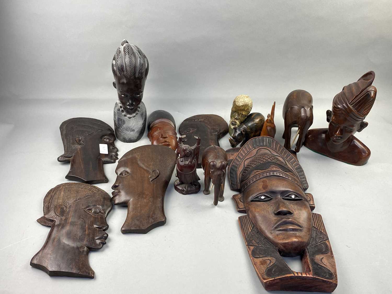 Lot 492 - A 20TH CENTURY CARVED WOOD BUST, WALL MASKS AND OTHER OBJECTS