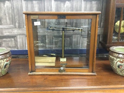 Lot 565 - A SET OF BAIRD & TILOCK LTD SCALES IN DISPLAY CASE