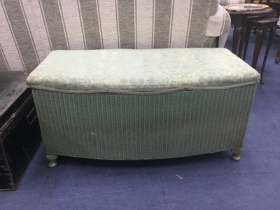 Lot 568 - A WICKER OTTOMAN AND A METAL CABIN TRUNK