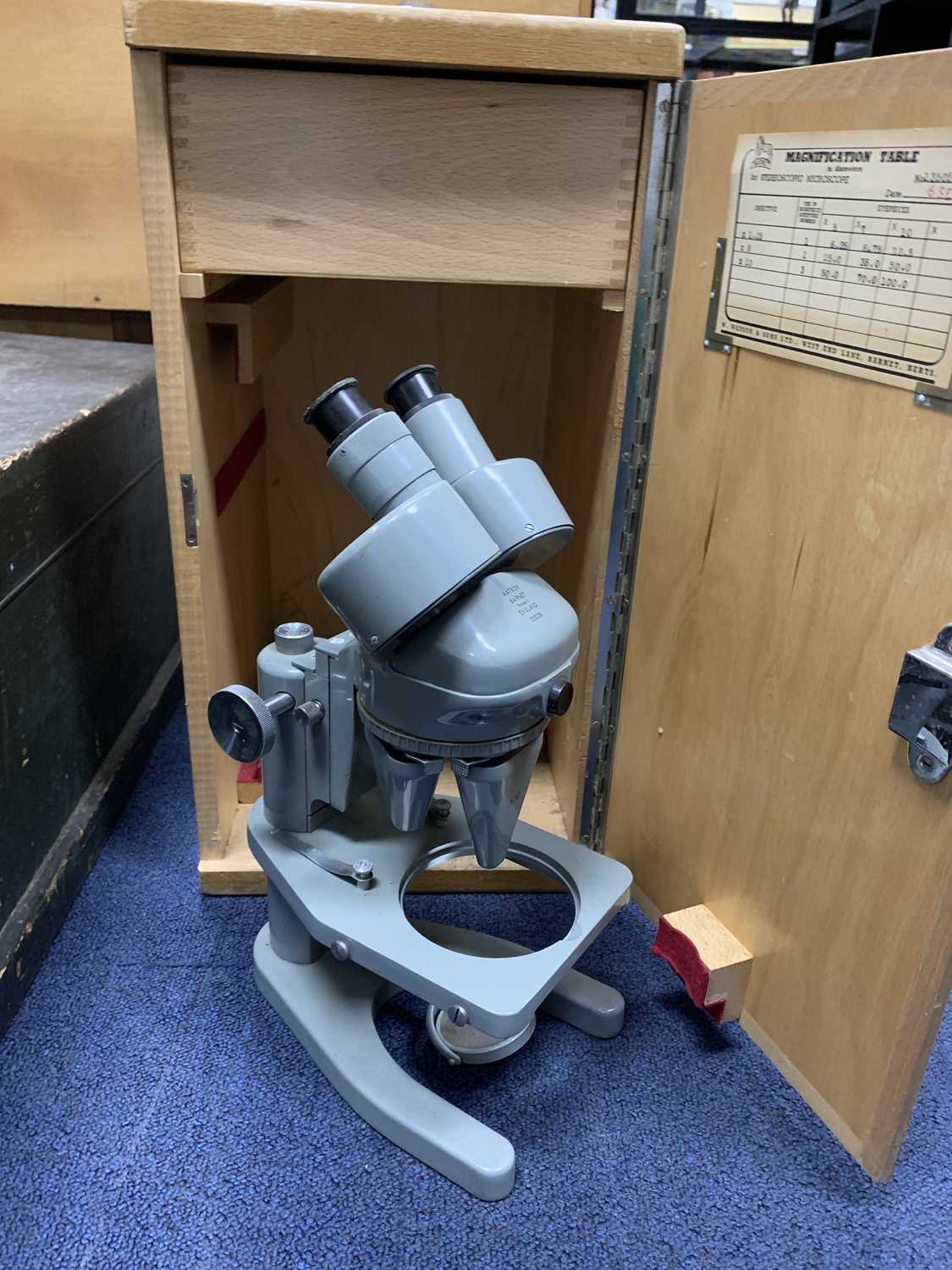 Lot 136 - A VINTAGE MICROSCOPE