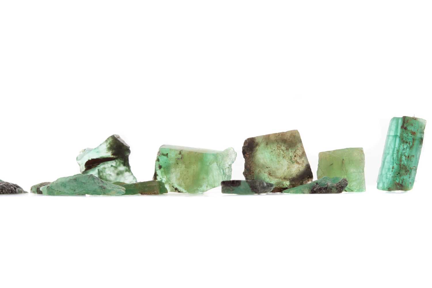 Lot 1526 - **A GROUP OF UNMOUNTED ROUGH EMERALDS