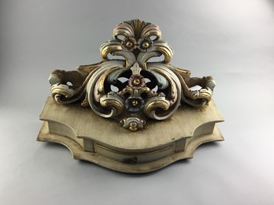 Lot 154 - A CREAM AND GILT PAINTED CARVED WOOD WALL BRACKET