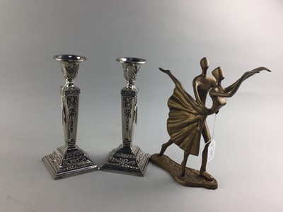 Lot 177 - A PAIR OF SILVER PLATED PLATED CANDLESTICKS AND A FIGURE GROUP