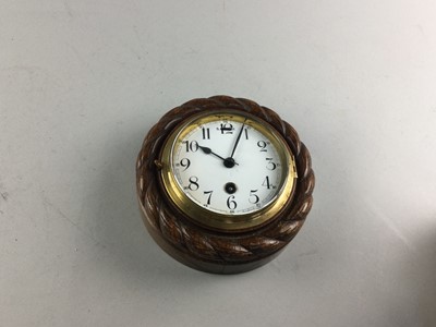 Lot 311 - AN EARLY 20TH CENTURY OAK WALL CLOCK