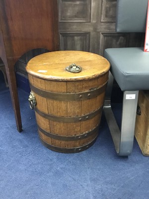 Lot 233 - AN OAK BARREL SHAPED LOG BIN