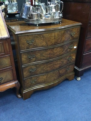 Lot 241 - A REPRODUCTION WALNUT SERPENTINE FRONT CHEST OF FOUR DRAWERS