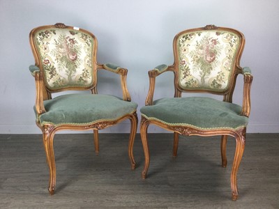 Lot 365 - A PAIR OF WALNUT OPEN ELBOW CHAIRS OF LOUIS XV DESIGN
