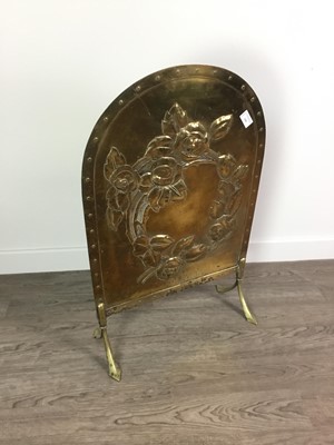 Lot 339 - AN EMBOSSED BRASS FIRESCREEN WITH ARCHED TOP