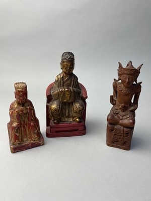 Lot 169 - TWO SMALL CHINESE CARVED WOOD SEATED FIGURES AND ANOTHER