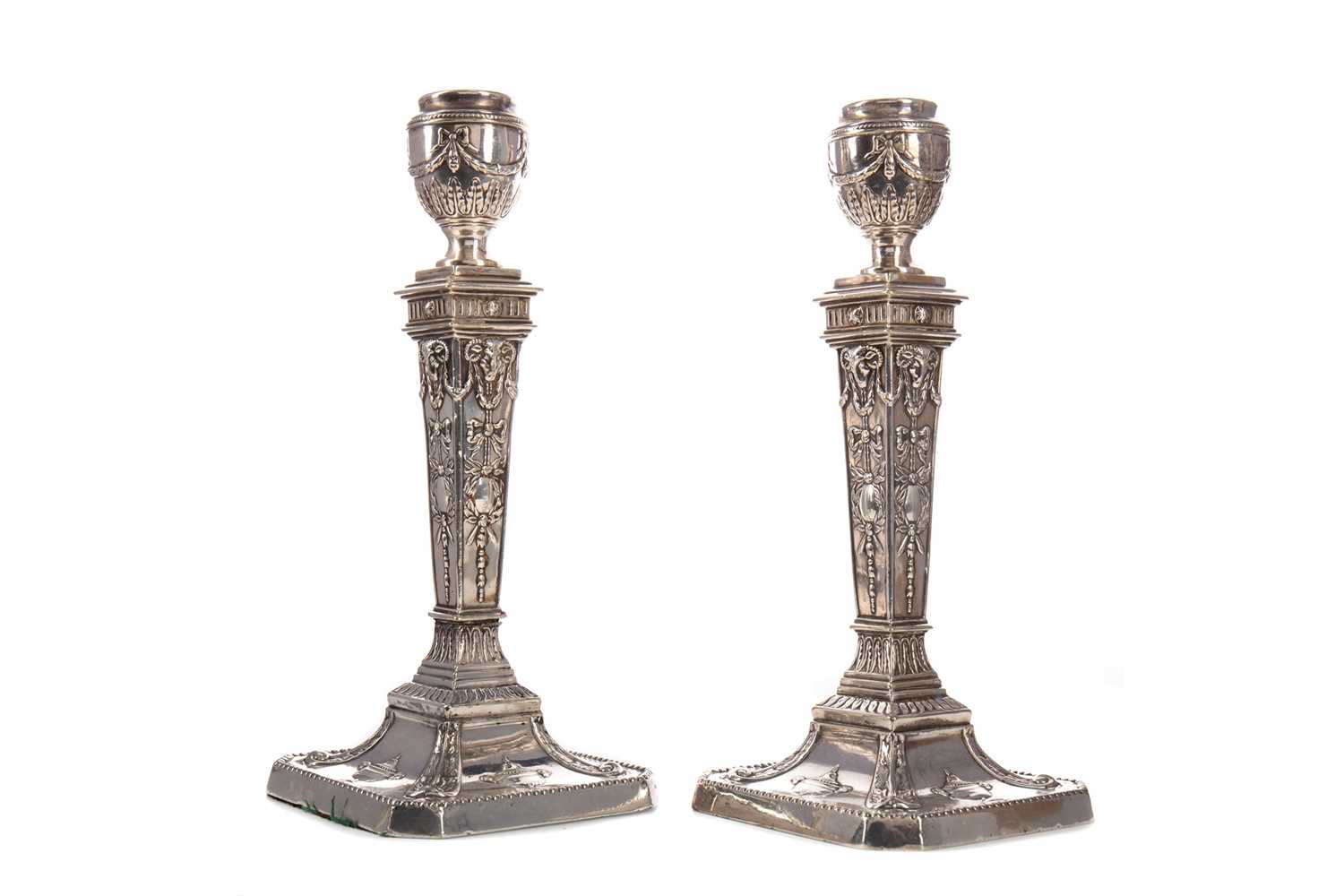 Lot 473 - A PAIR OF LATE VICTORIAN SILVER PLATED CANDLESTICKS