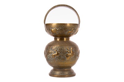 Lot 1754 - A 20TH CENTURY AFRICAN BRASS WATER CARRIER