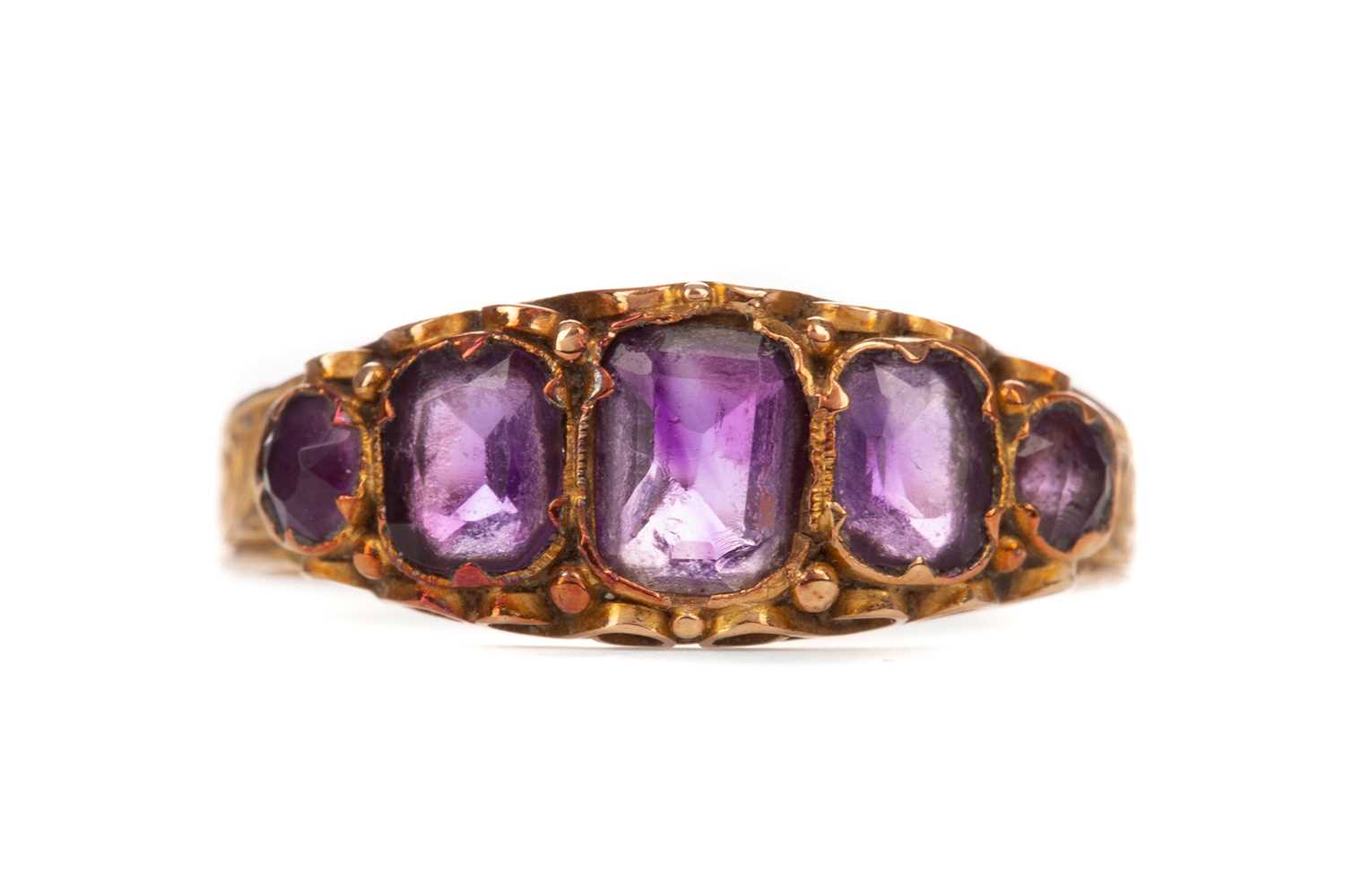 Lot 401 - A VICTORIAN AMETHYST FIVE STONE RING