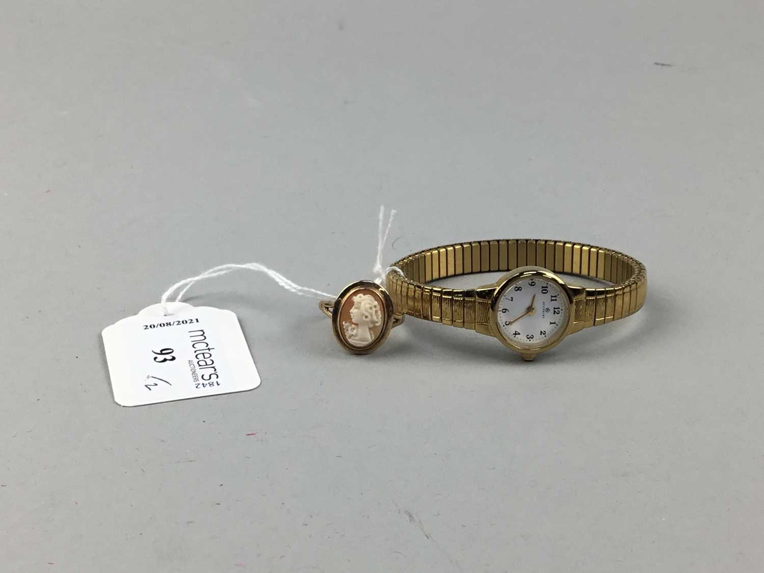 Lot 93 - A CAMEO DRESS RING AND A LADY'S ACCURIST WRIST WATCH