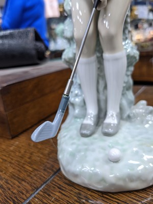 Lot 124 - A PAIR OF LLADRO HIS & HER FIGURES OF GOLFERS