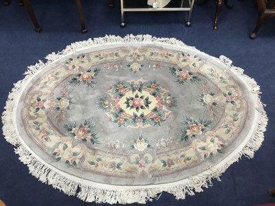 Lot 451 - A CHINESE FRINGED OVAL RUG