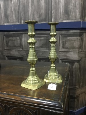 Lot 500 - A PAIR OF BRASS CANDLESTICKS