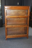 Lot 1006 - OAK SECTIONAL BOOKCASE with three sections,...