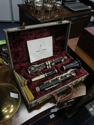 Lot 551 - A BOOSEY & HAWKS CLARINET ALONG WITH A BRASS TOMBONE