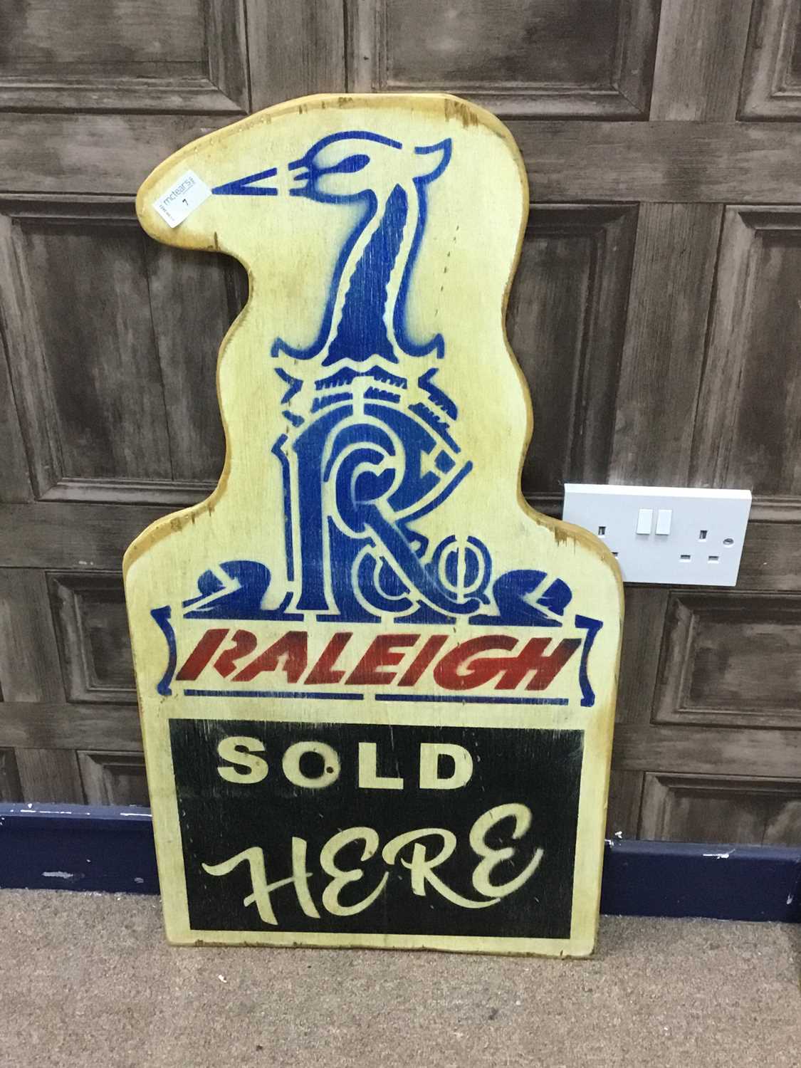 Lot 7 - A 'RALEIGH SOLD HERE' ADVERTISEMENT BOARD