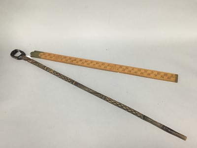 Lot 50 - A FOLDING BOXWOOD FIVE FOOT MEASURING STICK AND A TRIBAL WALKING STICK