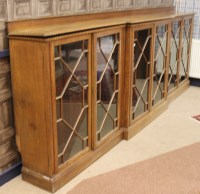 Lot 1033 - EDWARDIAN DWARF OAK BREAKFRONT BOOKCASE with...