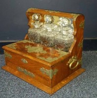 Lot 1042 - LATE VICTORIAN OAK FRAMED THREE GLASS BOTTLE...