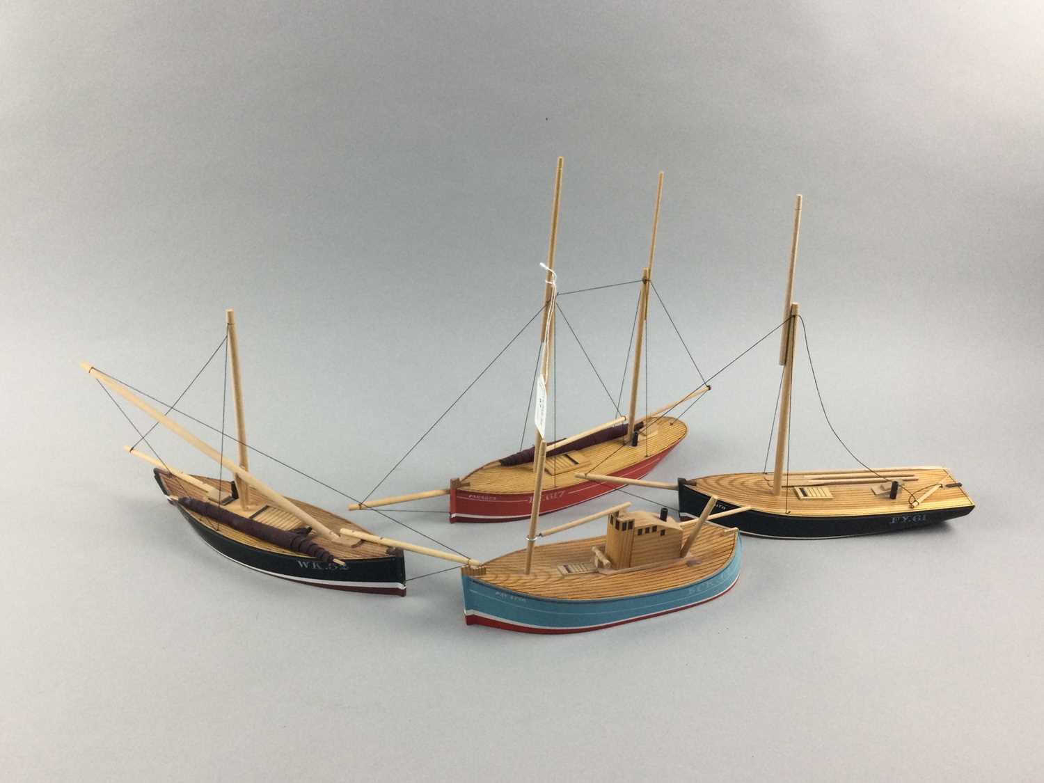 Lot 67 - A GROUP OF TEN PAINTED WOOD MODEL FISHING BOATS