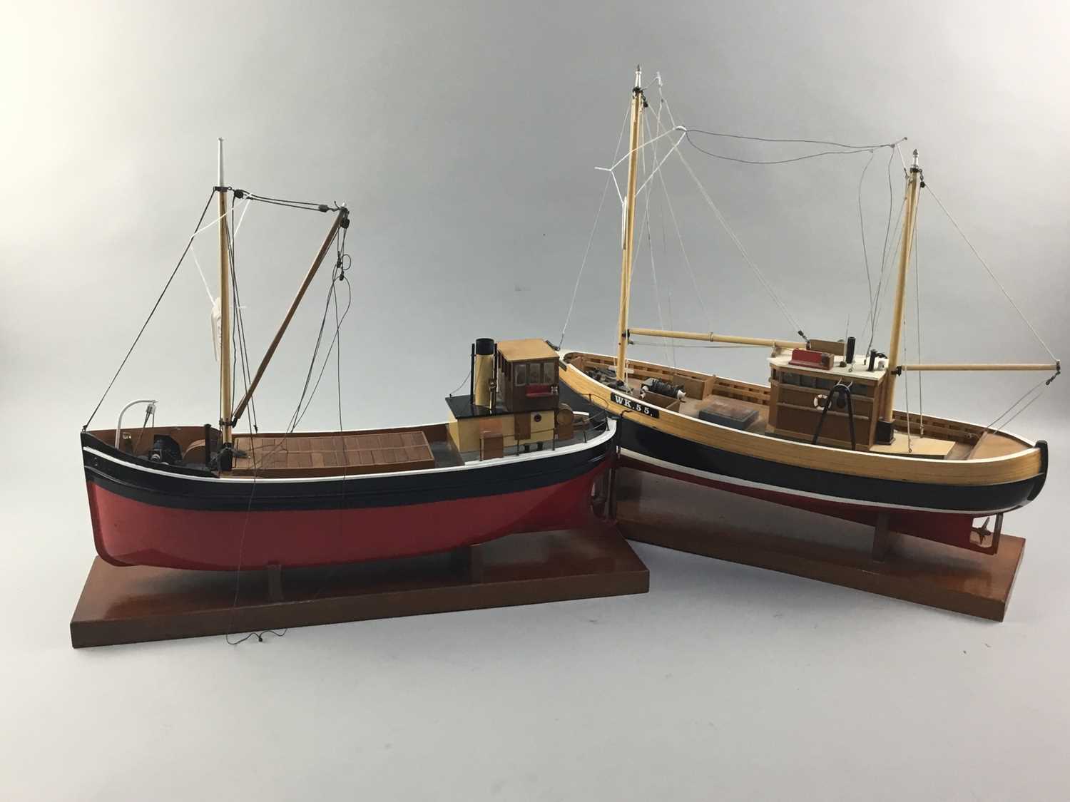 Lot 69 - A LOT OF TWO PAINTED WOOD MODEL FISHING BOATS