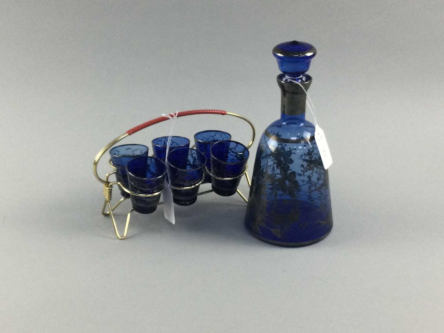 Lot 77 - A BLUE GLASS DECANTER AND SIX SHOT GLASSES