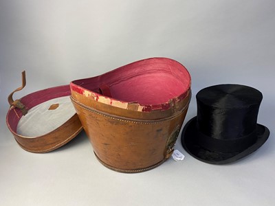 Lot 143 - A TOP HAT IN FITTED LEATHER CASE