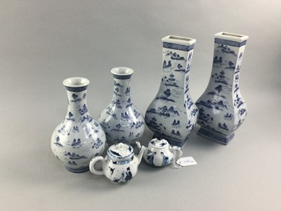 Lot 158 - A SET OF FOUR BLUE AND WHITE VASES AND TWO MINIATURE TEA POTS