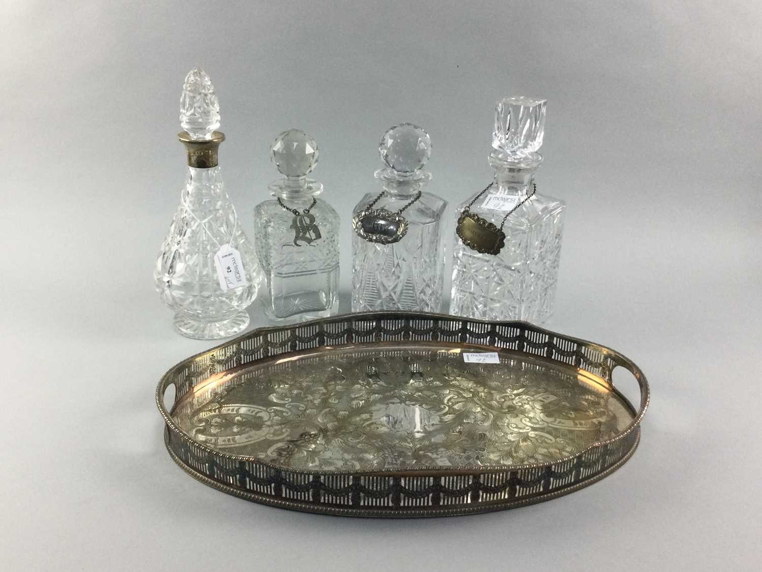Lot 92 - A LOT OF CRYSTAL DECANTERS AND A SILVER PLATED TRAY