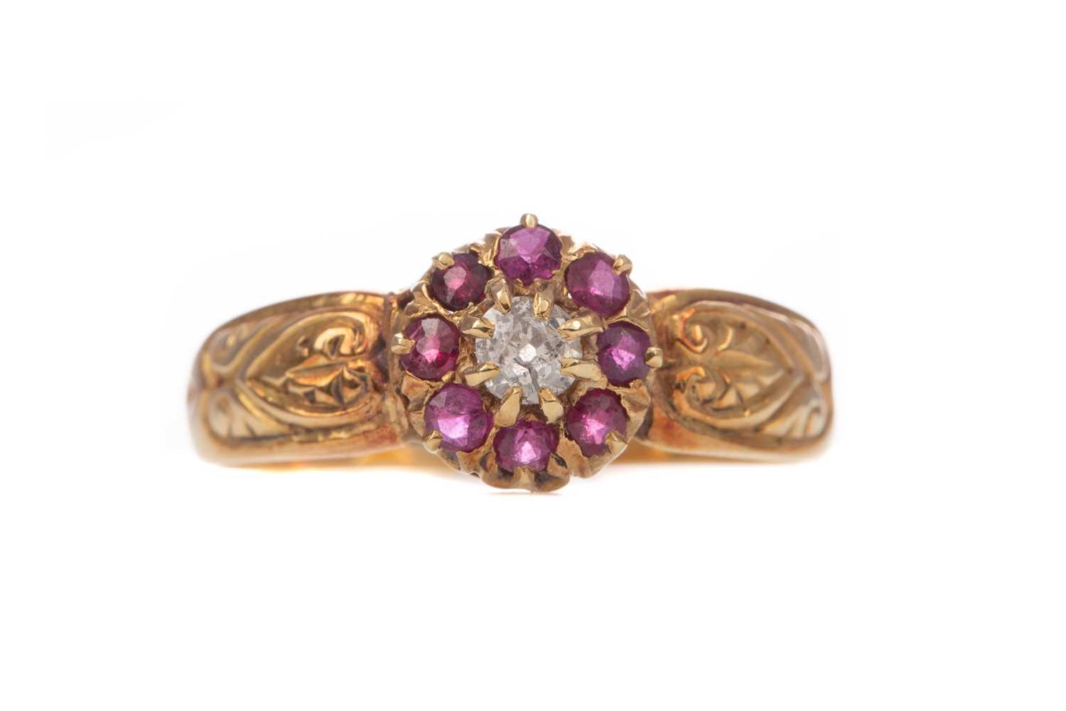 Lot 1414 - A RUBY AND DIAMOND CLUSTER RING