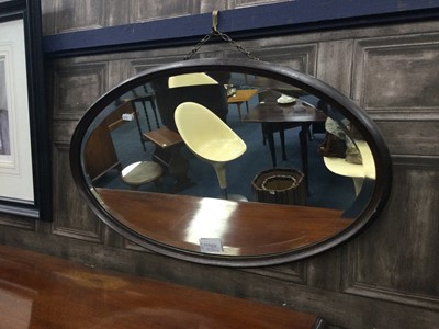 Lot 212 - A STAINED WOOD OVAL  WALL MIRROR AND ANOTHER