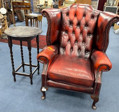 Lot 217 - A CHESTERFIELD WINGBACK ARMCHAIR AND AN OCCASIONAL TABLE