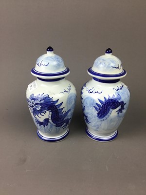 Lot 54 - A PAIR OF CHINESE BLUE AND WHITE VASES AND COVERS
