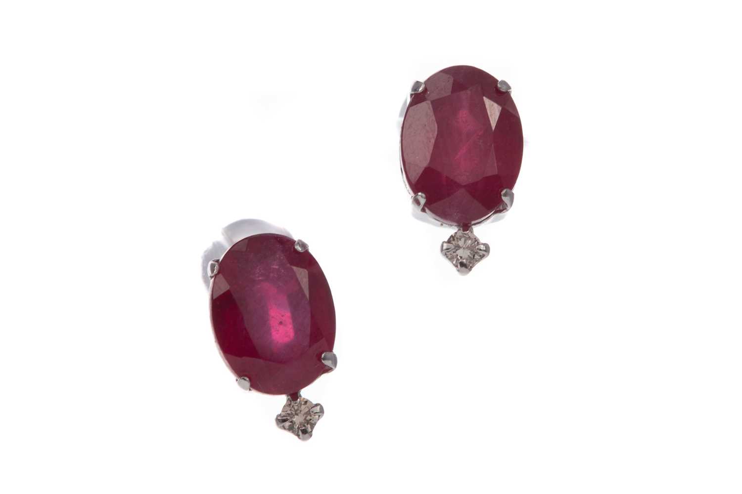 Lot 1353 - A PAIR OF RUBY AND DIAMOND STUD EARRINGS