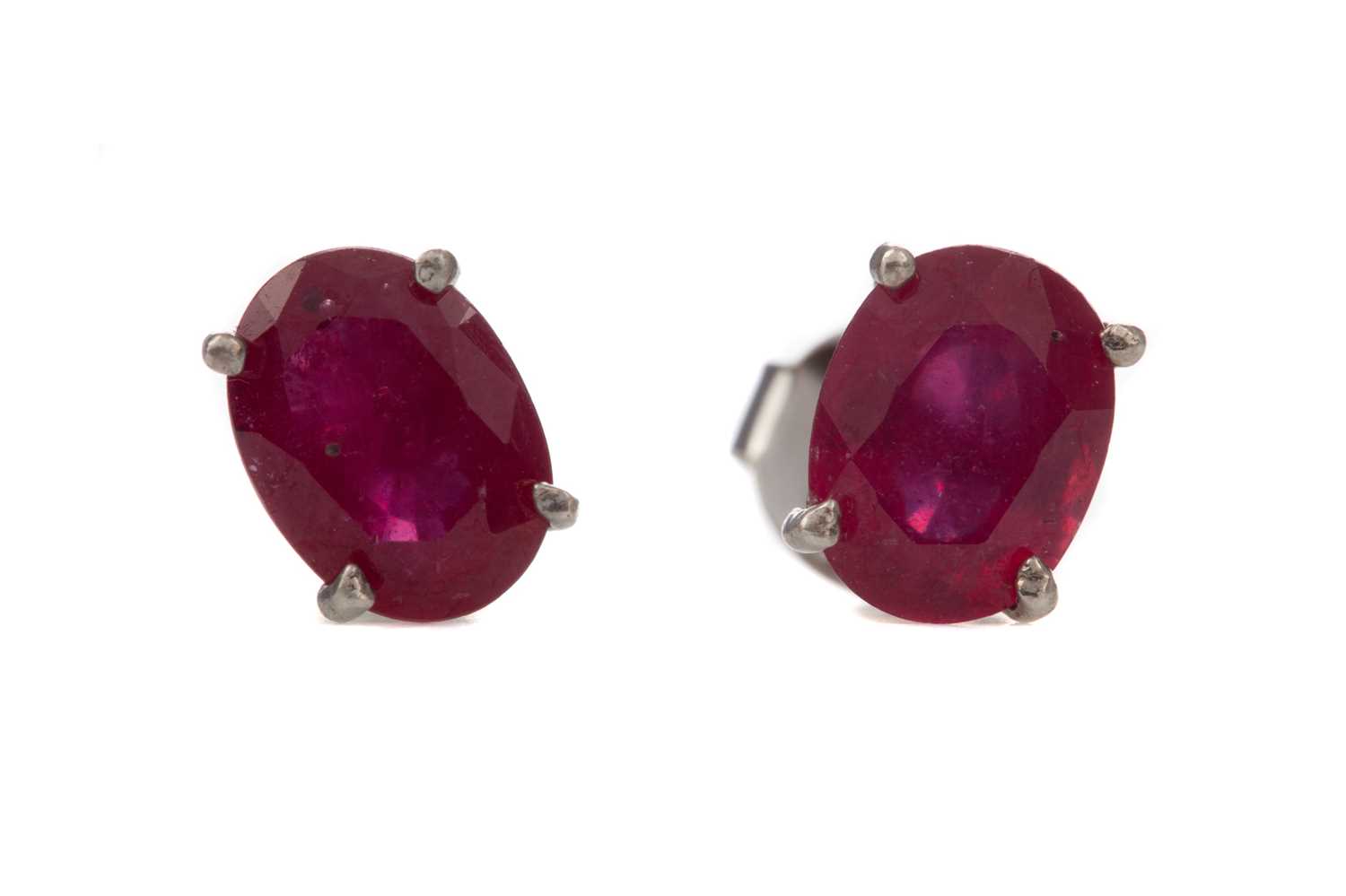 Lot 1415 - A PAIR OF TREATED RUBY STUD EARRINGS