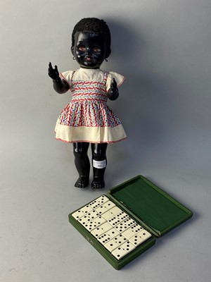 Lot 268 - A CHILD'S DOLL AND A CASED SET OF DOMINOS