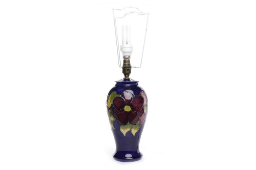 Lot 778 - MOORCROFT 'CLEMATIS' PATTERN LAMP of ovoid...